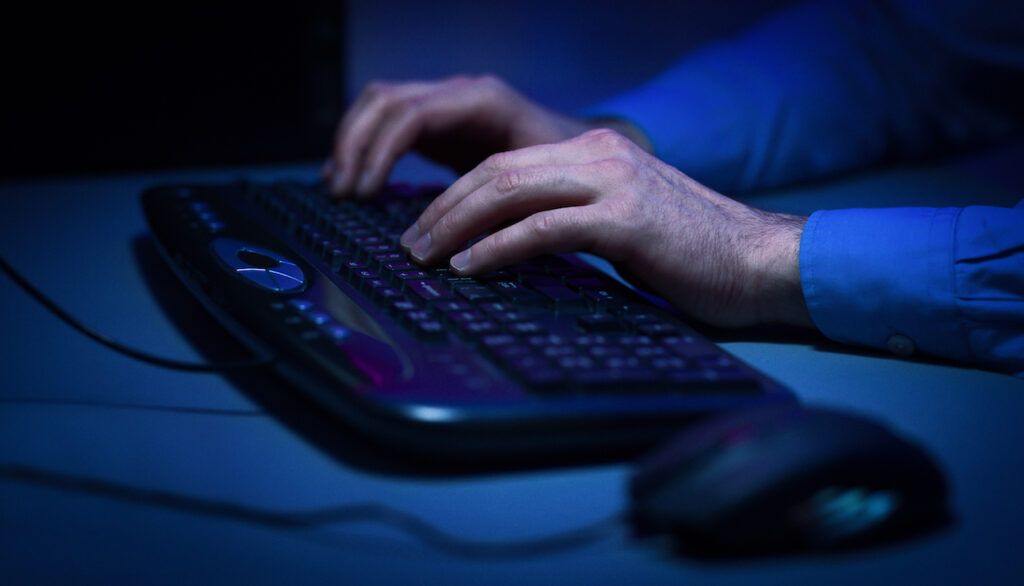 Man typing on a computer