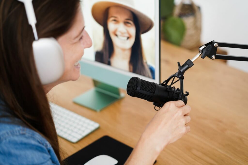 woman on zoom call speaking into microphone