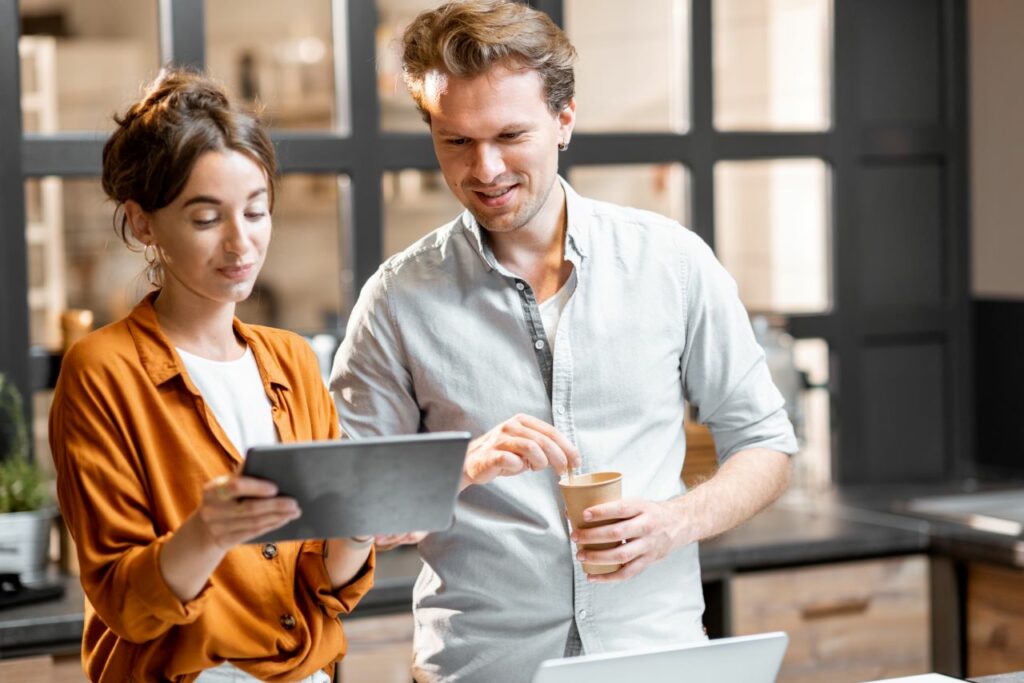 man and woman managing their small IT business