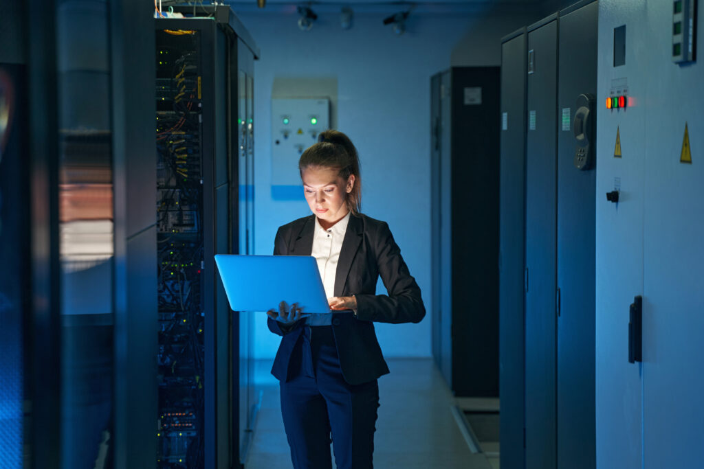 IT engineer specialist working on cybersecurity in a server room