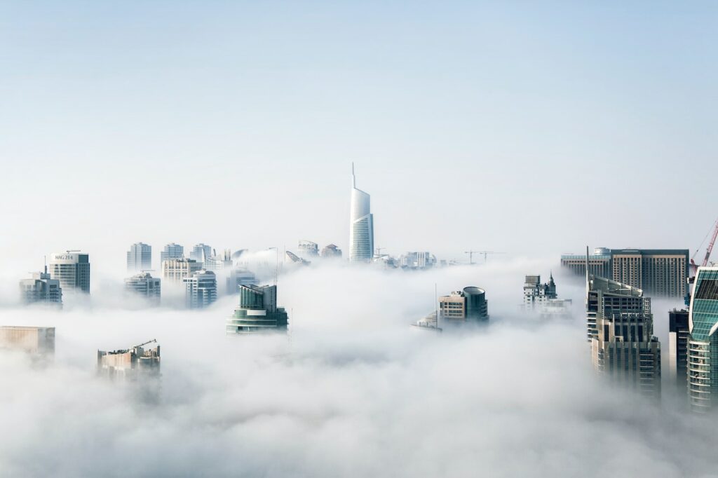 business building in the middle of clouds