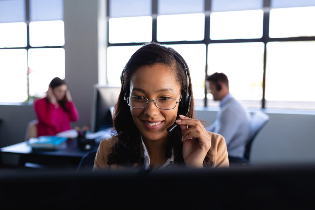 woman at work using office telephone system