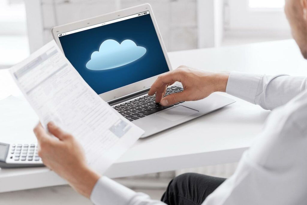 Employee reviewing cloud security solutions at desk